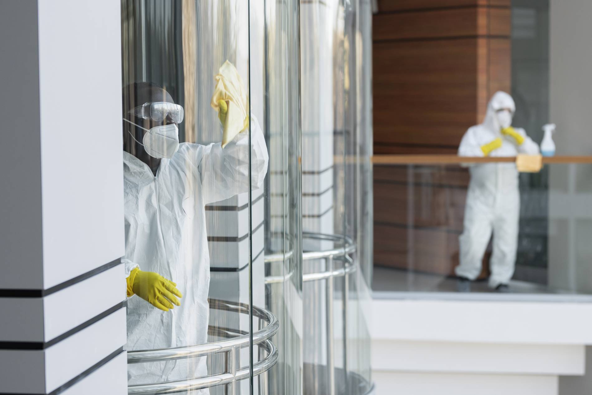 people-cleaning-hazmat-suits_1900x1267