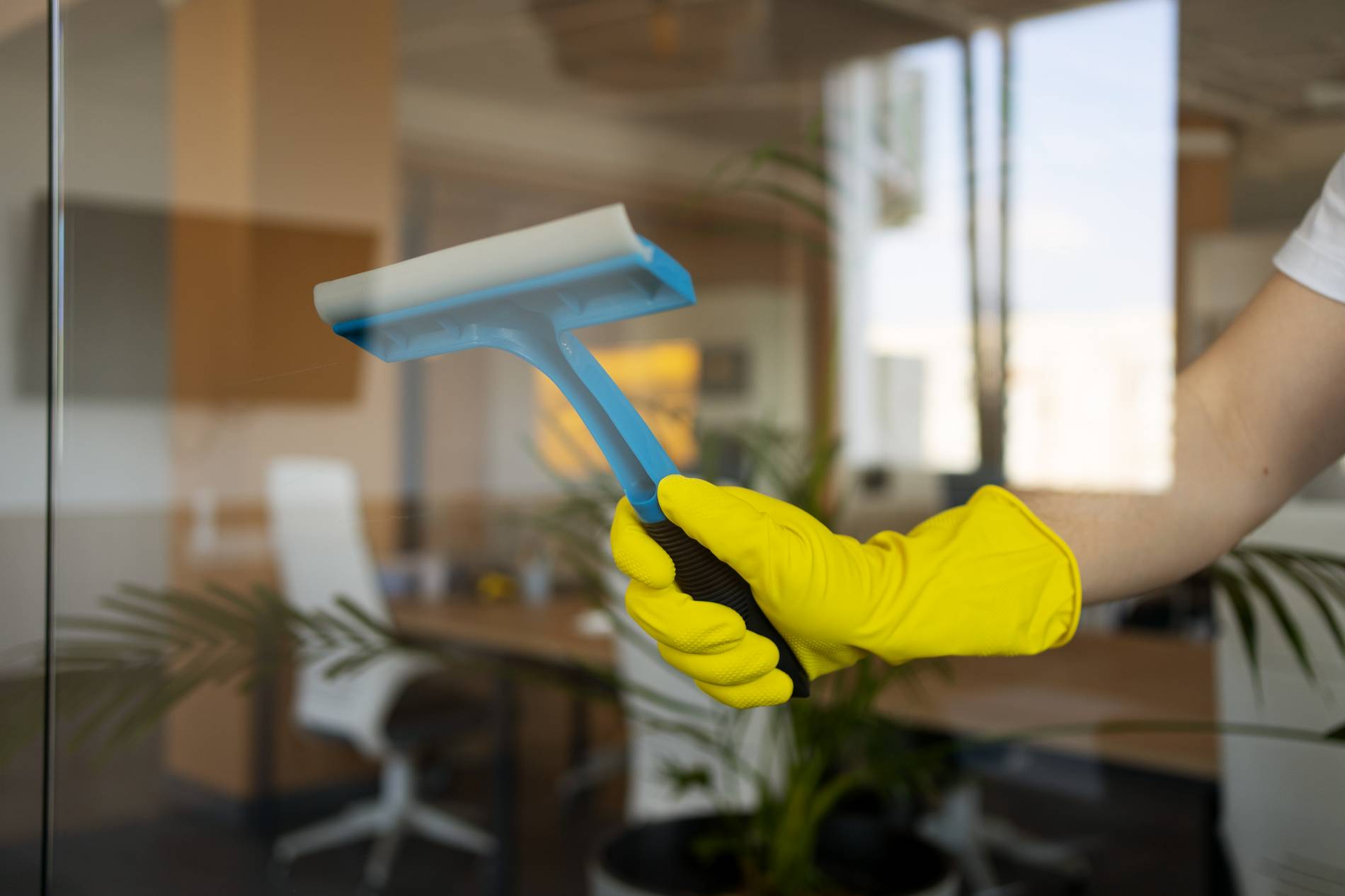 professional-cleaning-service-person-cleaning-office-window (2)_1900x1267
